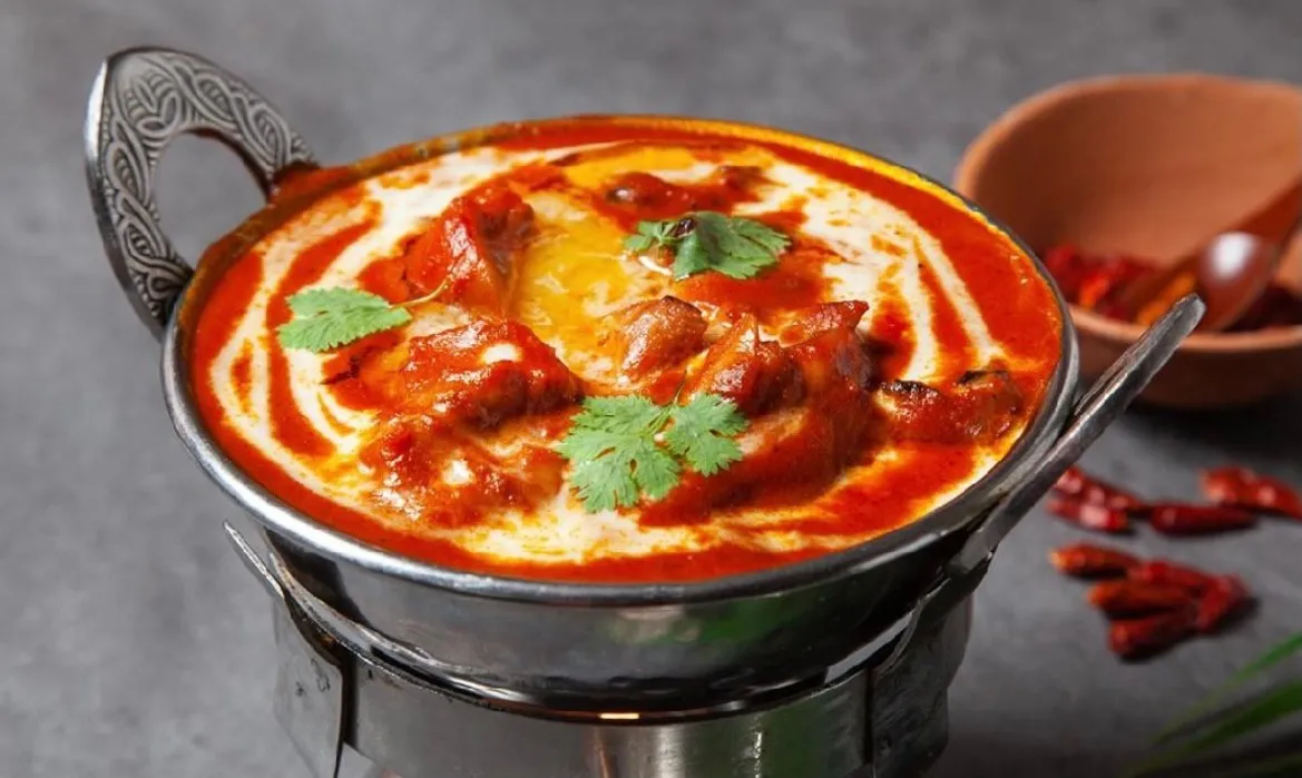 Kitchen of India — signature dish: Butter Chicken