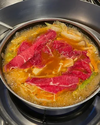 Choi's Spicy Mushroom Stew and Kalguksu — signature dish: Spicy Mushroom Shabu-Shabu